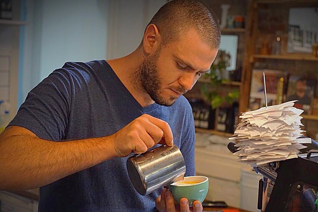 Johnny pouring latte art at The Steam Coffee Company